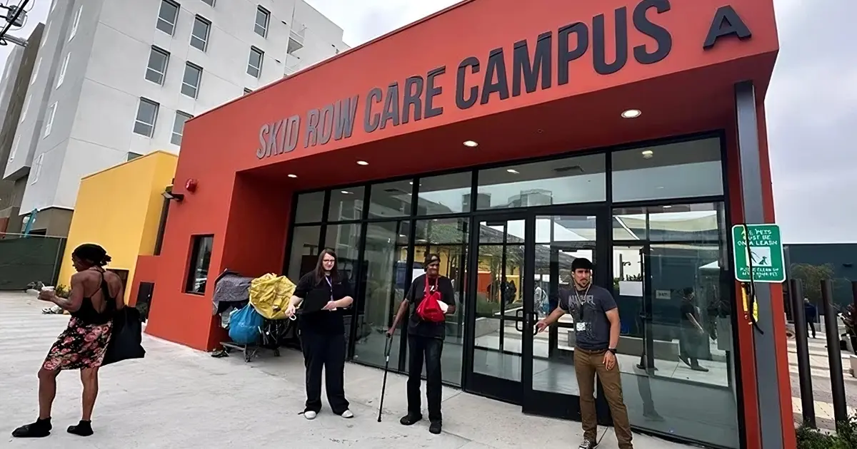 People at the entrance of the Skid Row Care Campus building at 442 South San Pedro Street in Los Angele